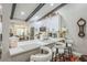 Bright kitchen featuring a breakfast bar overlooking a dining area and stainless appliances at 1490 Mahogany Ln # 706, Palm Harbor, FL 34683