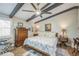 Bedroom with ceiling fan, wood beams, and furniture at 1490 Mahogany Ln # 706, Palm Harbor, FL 34683