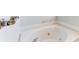 Close up of a bathroom featuring a corner jacuzzi style tub at 1603 21St W Ave, Palmetto, FL 34221