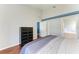 Bedroom featuring hardwood floors, a dark dresser, and access to the bathroom at 1603 21St W Ave, Palmetto, FL 34221