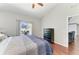 Bedroom with hardwood floors, a dresser, and a view of the pool and backyard at 1603 21St W Ave, Palmetto, FL 34221
