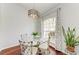 Bright dining room featuring a glass table, stylish chairs, and a large window at 1603 21St W Ave, Palmetto, FL 34221