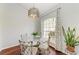 Bright dining room featuring a glass table, stylish chairs, and a large window at 1603 21St W Ave, Palmetto, FL 34221
