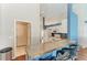 Bright and airy kitchen with bar seating and view into other rooms at 1603 21St W Ave, Palmetto, FL 34221