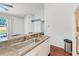 Kitchen sink with a view of the backyard pool, stainless steel sink and countertop at 1603 21St W Ave, Palmetto, FL 34221