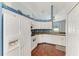 Bright eat-in kitchen with white cabinets and appliances and view of the yard at 1603 21St W Ave, Palmetto, FL 34221