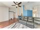 Bright living room features hardwood floors, a ceiling fan, and comfortable leather sofa at 1603 21St W Ave, Palmetto, FL 34221