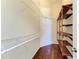Empty walk-in closet featuring wire shelving and wooden shoe racks at 1603 21St W Ave, Palmetto, FL 34221