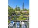 Aerial view of waterfront condos with private docks, lush landscaping, and boat slips at 1621 Boathouse Cir # 125, Sarasota, FL 34231