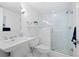 Clean bathroom features a glass shower and pedestal sink at 1621 Boathouse Cir # 125, Sarasota, FL 34231