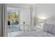 Bright bedroom boasts natural light and a sliding glass door leading to a private balcony at 1621 Boathouse Cir # 125, Sarasota, FL 34231