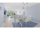 Bright and airy dining area with modern furnishings, connecting seamlessly to the living room and kitchen at 1621 Boathouse Cir # 125, Sarasota, FL 34231