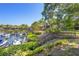 Picturesque dock with lush greenery and waterfront views, providing serene access to the water and boat slips at 1621 Boathouse Cir # 125, Sarasota, FL 34231