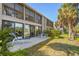 Exterior features a spacious deck with seating and waterfront views of the lush landscaping at 1621 Boathouse Cir # 125, Sarasota, FL 34231