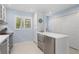 Updated kitchen with stainless steel appliances, a cozy island, and white cabinets offering plenty of storage at 1621 Boathouse Cir # 125, Sarasota, FL 34231