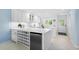 Well-lit kitchen with white countertops, stainless steel appliances, and a functional layout for cooking and prep at 1621 Boathouse Cir # 125, Sarasota, FL 34231