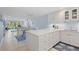 Open-concept kitchen and dining area with a center island, perfect for entertaining and casual dining at 1621 Boathouse Cir # 125, Sarasota, FL 34231