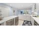 Spacious kitchen seamlessly flowing into the living areas, featuring modern appliances and ample counter space at 1621 Boathouse Cir # 125, Sarasota, FL 34231