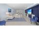 Spacious living room displays an open floor plan, recessed lighting, and sliding glass doors at 1621 Boathouse Cir # 125, Sarasota, FL 34231