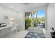 Bright office space with sliding glass doors leads to a private deck with beautiful water views at 1621 Boathouse Cir # 125, Sarasota, FL 34231