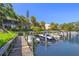 Beautiful waterfront view of a marina with boat slips, accessible by a scenic wooden boardwalk at 1621 Boathouse Cir # 125, Sarasota, FL 34231