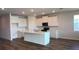 Bright kitchen features an island with marble counters, stainless appliances, and plenty of cabinet space at 17041 James Trl, Parrish, FL 34219