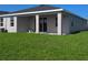 Back patio with a covered area at 17041 James Trl, Parrish, FL 34219