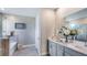 Bright bathroom with double vanity, large mirror, and walk-in shower at 17917 Tavernside Trl, Lakewood Ranch, FL 34211