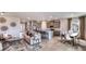 Spacious open-concept living area that flows into a modern kitchen and dining space for seamless entertaining at 17917 Tavernside Trl, Lakewood Ranch, FL 34211