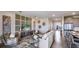 Open-concept living area with modern decor, neutral tones, and seamless flow to the kitchen at 17917 Tavernside Trl, Lakewood Ranch, FL 34211