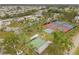 Aerial view showcasing the community amenities like pool, tennis, and bocce ball courts at 182 Crown Point Dr, Nokomis, FL 34275