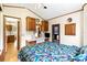Bedroom includes a large bed, desk, closet and large mirror, with views to the living spaces at 182 Crown Point Dr, Nokomis, FL 34275
