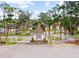 Welcoming gated entrance with manicured landscaping for a secure and attractive community at 182 Crown Point Dr, Nokomis, FL 34275