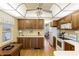 Spacious kitchen with abundant cabinetry, essential appliances, and easy access to adjacent dining area at 182 Crown Point Dr, Nokomis, FL 34275