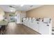 Clean laundry room equipped with multiple washers and dryers for convenience at 182 Crown Point Dr, Nokomis, FL 34275