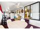 Bright living area boasts a table, seating, ceiling fan, and ample natural light, creating a warm atmosphere at 182 Crown Point Dr, Nokomis, FL 34275