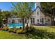 Beautiful backyard with a pool, colorful flower garden, and charming exterior details at 1829 Bougainvillea St, Sarasota, FL 34239