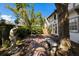 Charming backyard with a fountain, statue, brick patio, and mature trees provides a private retreat at 1829 Bougainvillea St, Sarasota, FL 34239