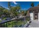 Charming balcony overlooking a lush neighborhood with landscaped views and iron railings at 1829 Bougainvillea St, Sarasota, FL 34239