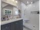 Elegant bathroom with a modern vanity, glass-enclosed shower, and neutral color palette at 1829 Bougainvillea St, Sarasota, FL 34239