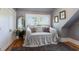 Cozy bedroom featuring wood floors, shuttered windows, and a comfortable daybed at 1829 Bougainvillea St, Sarasota, FL 34239