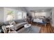 Elegant bedroom with a chaise lounge, shuttered windows, and beautiful detailing for a luxurious feel at 1829 Bougainvillea St, Sarasota, FL 34239