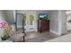 Bright bedroom boasts balcony access, dresser with TV, and lovely decor at 1829 Bougainvillea St, Sarasota, FL 34239
