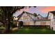 Charming exterior elevation with well-maintained lawn and mature trees, complemented by a balcony feature at 1829 Bougainvillea St, Sarasota, FL 34239