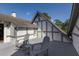 Exterior angled view of property with a deck and two gray Adirondack chairs at 1829 Bougainvillea St, Sarasota, FL 34239