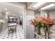 Bright foyer featuring a decorative mirror, flowers, and an elegant view of the kitchen at 1829 Bougainvillea St, Sarasota, FL 34239