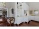 Hallway featuring custom built-ins, stylish decor, and hardwood floors at 1829 Bougainvillea St, Sarasota, FL 34239