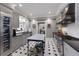 Well-appointed kitchen featuring stainless steel appliances, custom cabinetry, and central island at 1829 Bougainvillea St, Sarasota, FL 34239