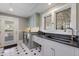 Modern laundry room with sleek countertops, stylish cabinets, washer, dryer and beautiful windows at 1829 Bougainvillea St, Sarasota, FL 34239
