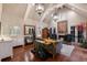 Cozy living room featuring high ceilings, a fireplace, stylish furniture, and hardwood floors at 1829 Bougainvillea St, Sarasota, FL 34239